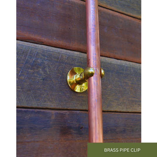 Close up of brass pipe clips