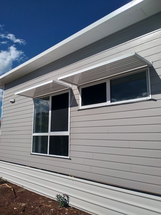 White awning on grey wall