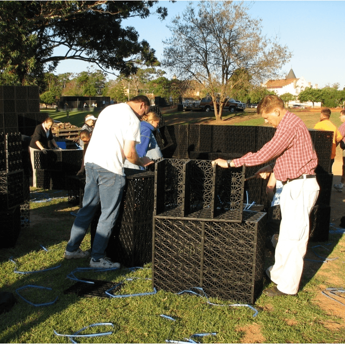 Load image into Gallery viewer, Flo tank being assembled by hand on site
