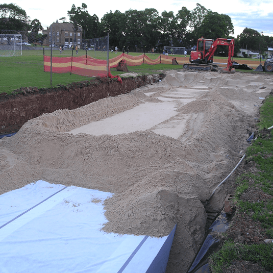 Detention tank covered with sand